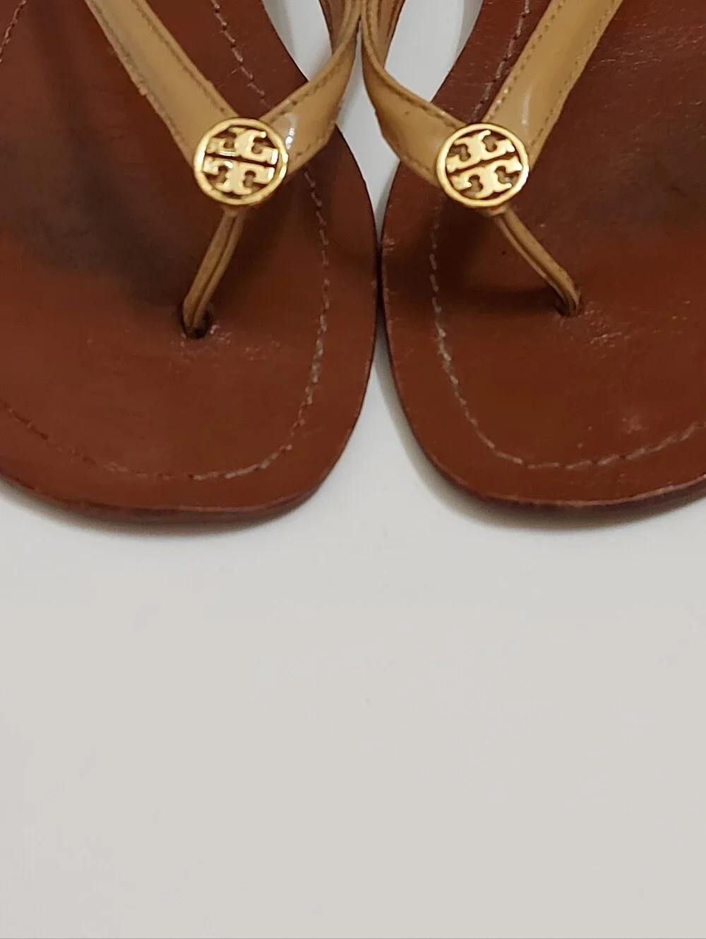 Tory Burch Brown Leather Flip Flop Sandals with Tan Straps and Gold Medallion
